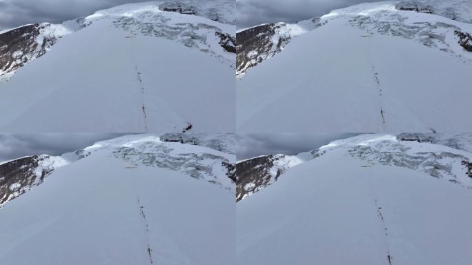 航拍攀登冰川之父慕士塔格峰雪山的登山队