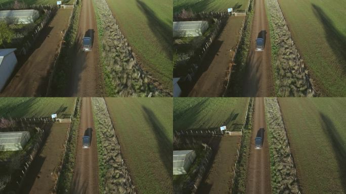 乡村土路上汽车的鸟瞰图