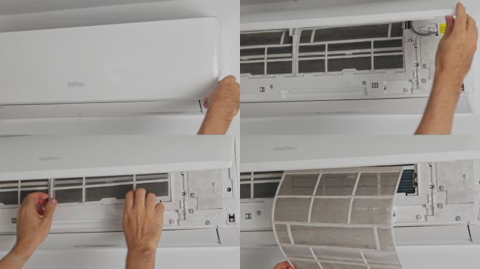 清洁技术人员打开壁挂式空调前盖，取下过滤网进行清洁