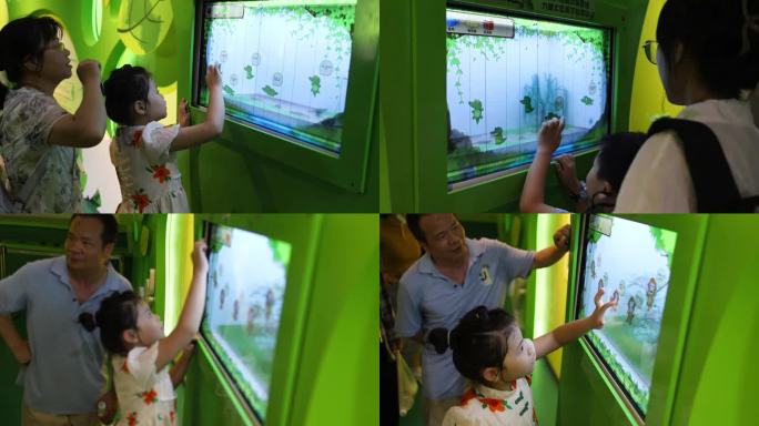 小孩在屏幕上认识动物