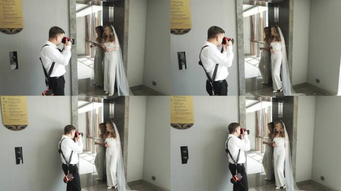 后台婚礼拍摄。身着婚纱、头戴面纱的新娘站在镜子前。