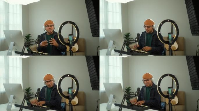 在家里的数码录音棚里，戴着耳机的音乐人对着镜头微笑着，通过在线课程教授钢琴键盘;站着用智能手机录制音