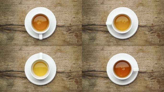 定格动画，一个瓷茶杯在碟子上慢慢地装满茶，因为它旋转。