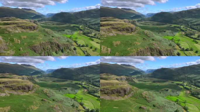 飞过陡峭的山坡，飞向宽阔的绿色山谷，远山和夏日的湖泊。英国坎布里亚郡湖区国家公园