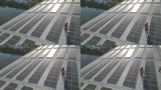 工人技术人员正在屋顶上建造太阳能电池板系统。安装太阳能光伏板系统。男技师走在屋顶结构上检查光伏太阳能