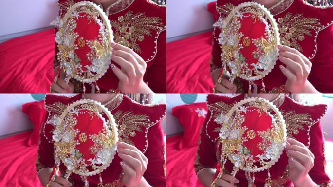 手指优雅抚摸中式扇子女人新娘