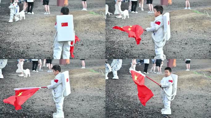 爱国男孩挥动五星红旗，太空服五星红旗