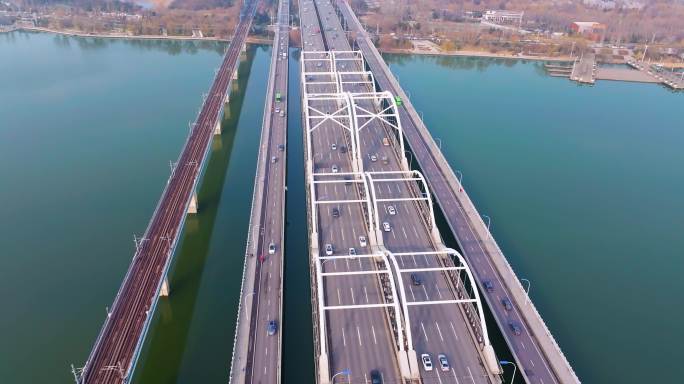 航拍城市生态区河流和轨道交通桥梁及公路桥