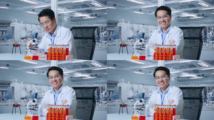 亚洲男科学家在实验室里通过显微镜观察，微笑着双臂交叉