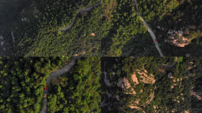 盘山公路上行驶的红色汽车
