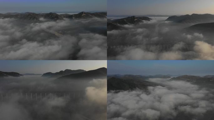航拍群山云海中的高架铁路