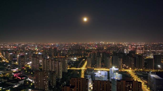 月光下的城市万家灯火夜生活夜景