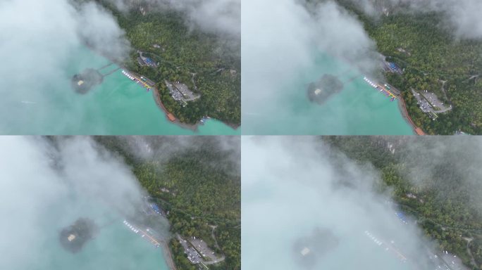 航拍云雾缭绕下的西藏林芝巴松措湖心岛