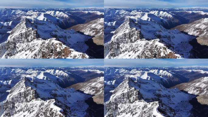 航拍岷山山脉雪宝顶雪山山脊上的登山队