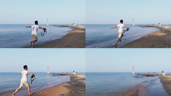 摄影师海边自由奔跑 无人机跟拍