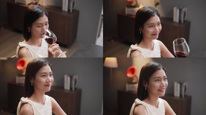 女生用玻璃杯喝红酒