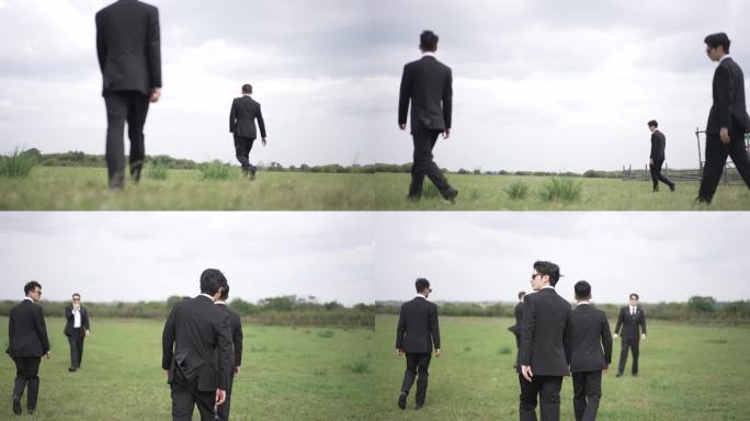 草原上很多西装男行走