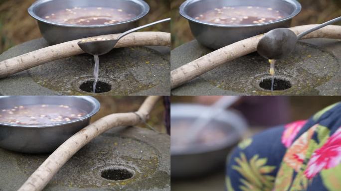 东北农村石磨懒豆腐制作磨豆子