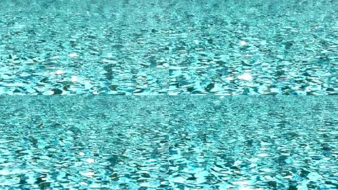 水波荡漾，光影在游泳池中闪烁。