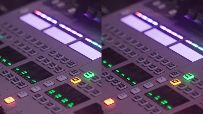 DJ在现场表演中混音。镜头特写现代控制台，滑块和手按下背光霓虹按钮。