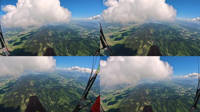 高空滑翔伞飞行冒险，穿越绿色乡村上方的云层天空。