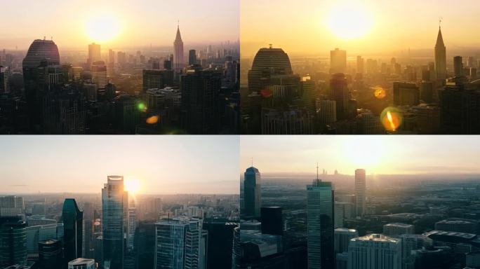清晨透过城市建筑群看太阳缓缓升起