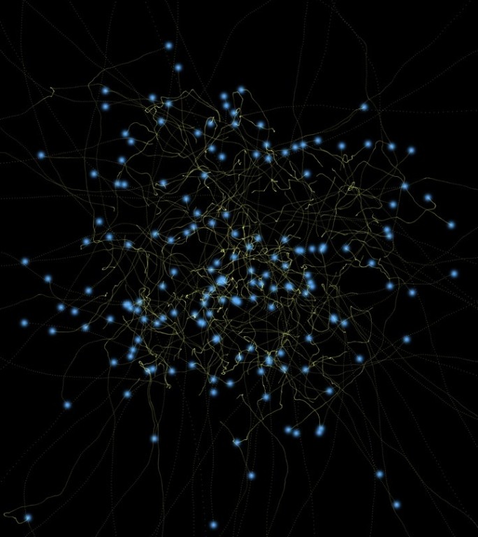 粒子轨迹：蓝色、金色，黑色背景