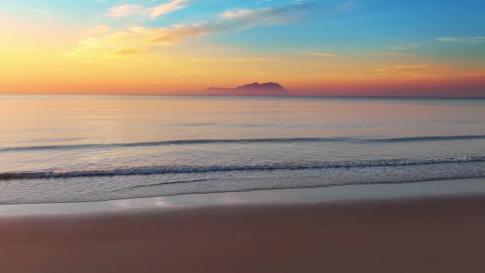 海边日出朝霞与海岛