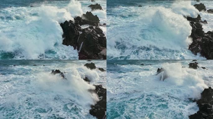 海浪撞击岩石海岸，沿着海岸悬崖形成令人惊叹的自然奇观。大西洋中海浪撞击岩石的空中慢动作镜头。