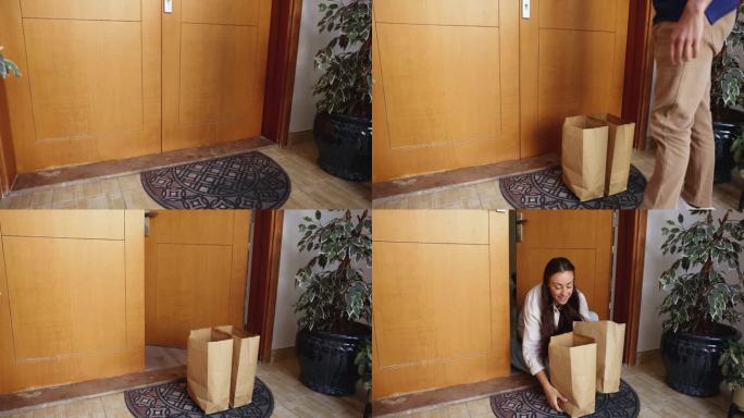 中年男性快递员手提纸购物袋送货给顾客。