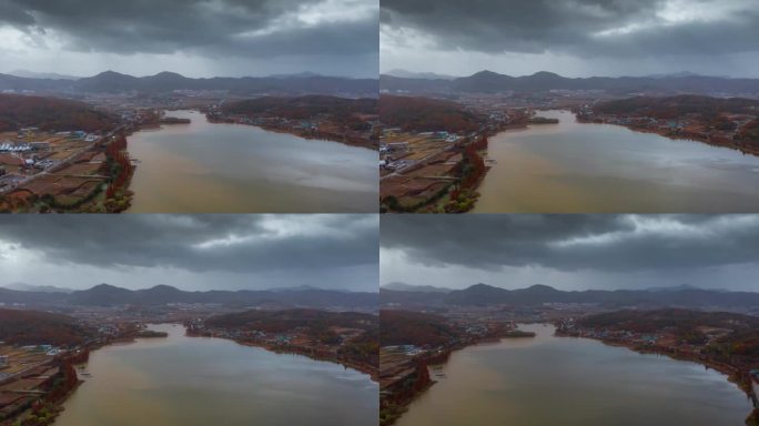 ASAN, 韩国 - 2024年10月9日：秋天的云彩聚集在宁静的阿山湖上，映照出季节变化的色彩。
