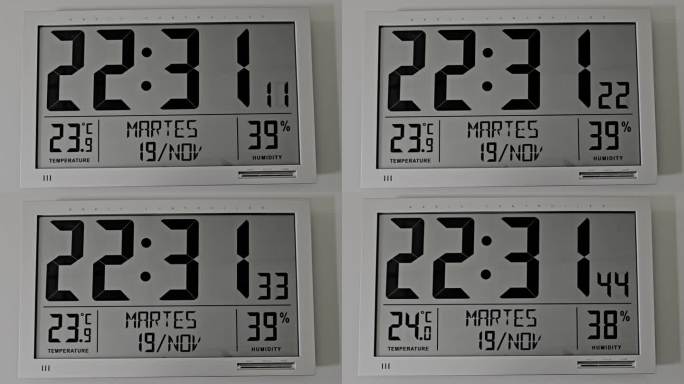 数字墙钟，带日期、温度、秒针、星期几、月份，黑白色。银灰色。