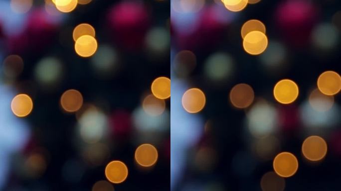 模糊的倒置圣诞树在冬季傍晚街道的虚焦中。