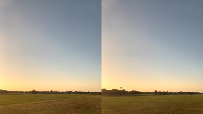 夕阳下田野上火车上的镜头