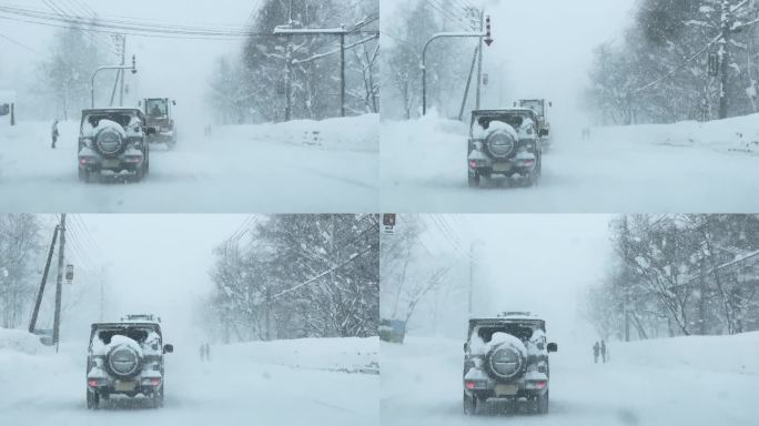 在大雪纷飞的小镇上，覆盖着雪的车辆小心翼翼地行驶。