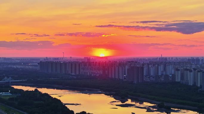 辽宁朝阳喀左凌河航拍城市日出