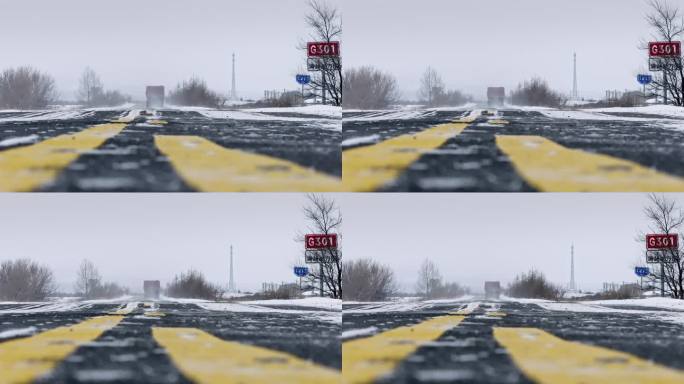 物流运输汽车行驶在冬季飘雪的公路上