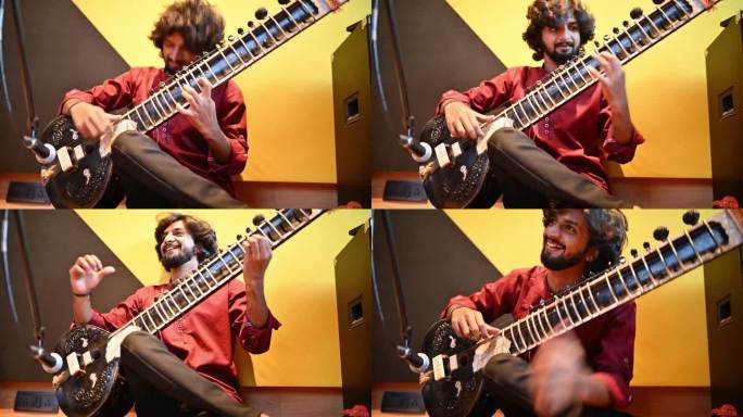 一个年轻人在演奏西塔尔琴