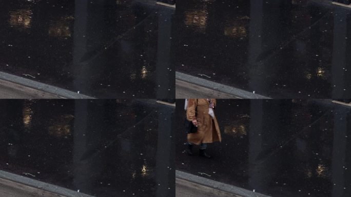 特写雨中的人行道上的行人