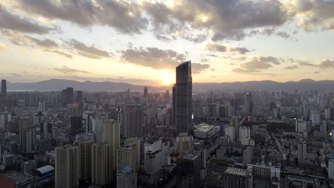 航拍昆明东风东路主城区日落西山晚霞