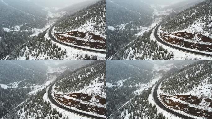 4K航拍雪天白色汽车行驶在高原雪山公路