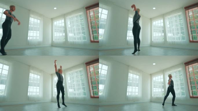 一名男芭蕾舞者在一扇大窗户前跳舞，工作室背景是年轻时尚的现代芭蕾舞者