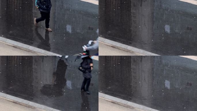 雨中的巴黎街道的高架视图。行人在人行道上行走