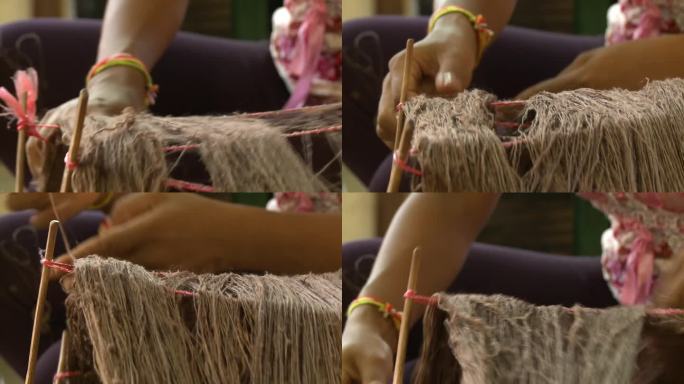 在工厂里解开棕色丝线