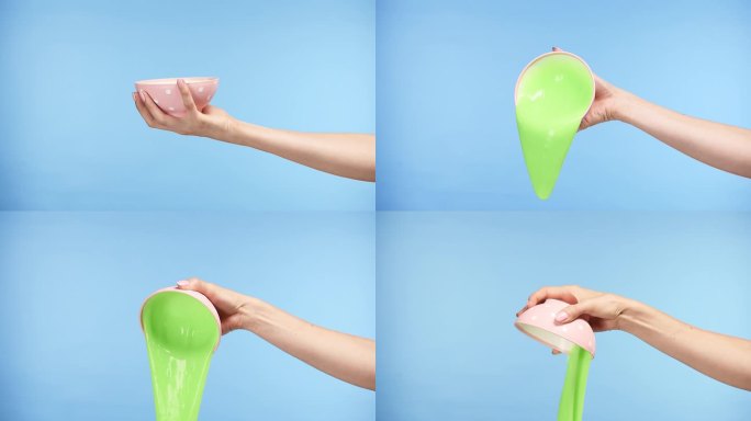 用手从粉红色的碗里倒出绿色的粘液