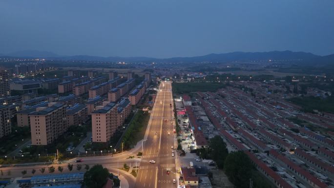 航拍夜幕降临华灯初上的威海文登区