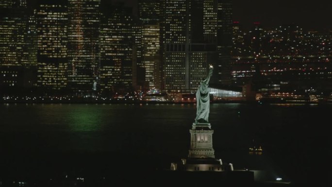 AERIAL MS View of statue of liberty at night with 