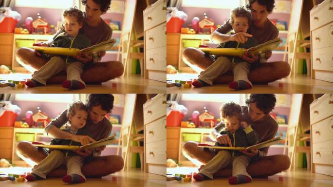 一位父亲给他的小儿子读故事。