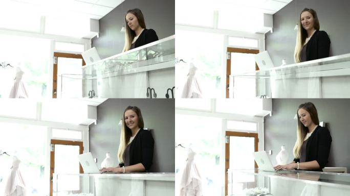 中等拍摄的销售助理在一个婚礼沙龙