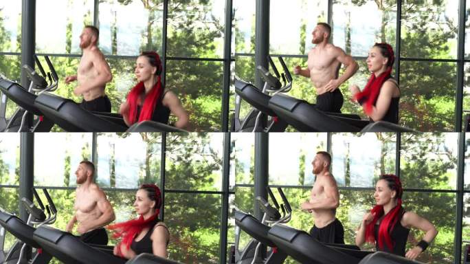 健身房跑步机上，男士和女士一起训练，慢跑健身锻炼。在功能性的交叉训练前热身，重点关注男士。